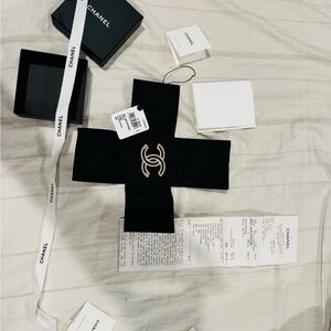 CHANEL Black and Gold Logo Brooch